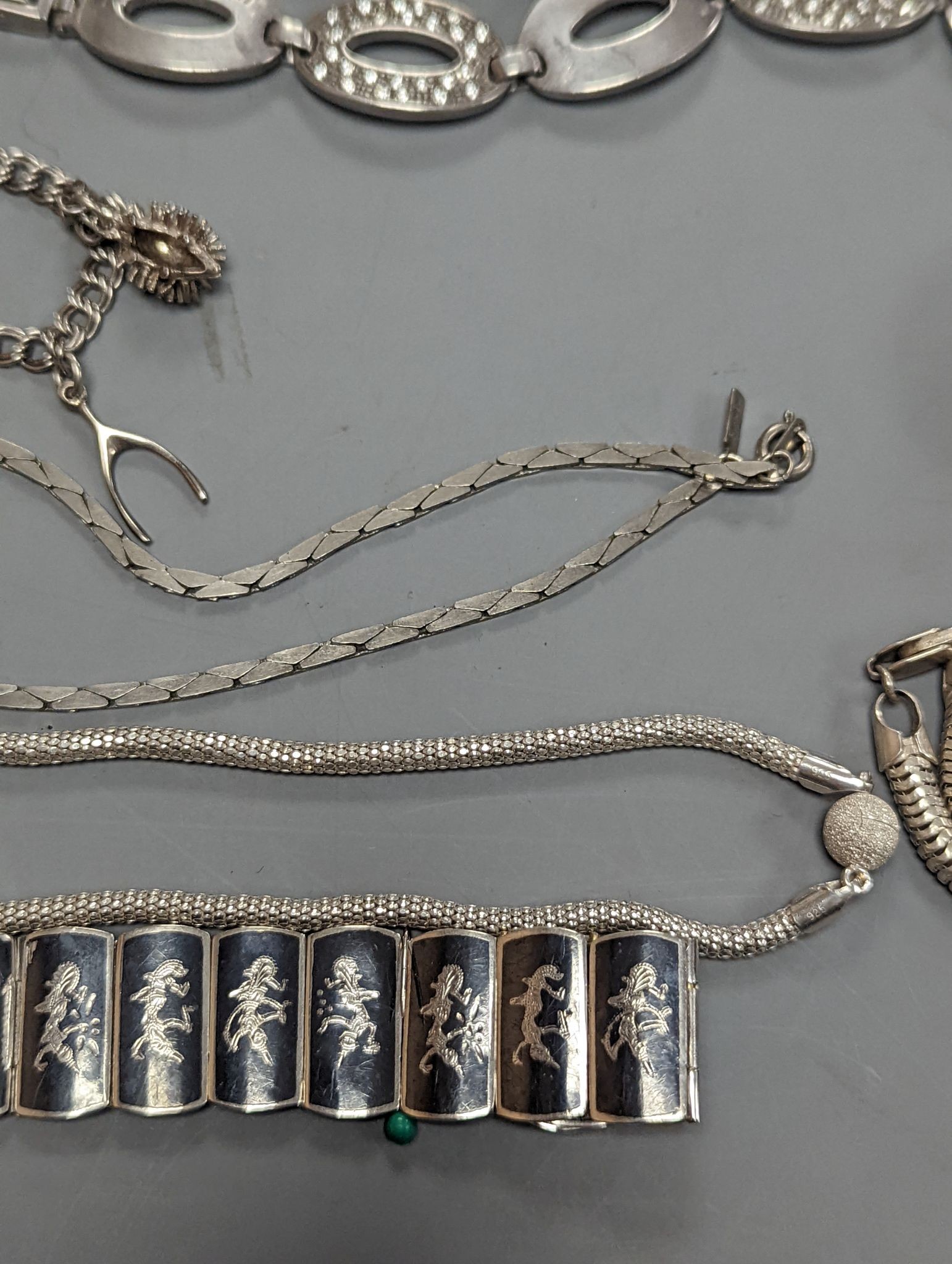 A quantity of assorted jewellery etc. including Danish sterling bangle and leaf brooch, a white meta and niello bracelet and a 925 and enamel flower brooch.